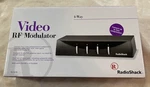 Radio Shack 4 Way Rf Modulator Pn 15-1215 New Open Box Cable Coax S-video Game. Fixed Price $20.99.